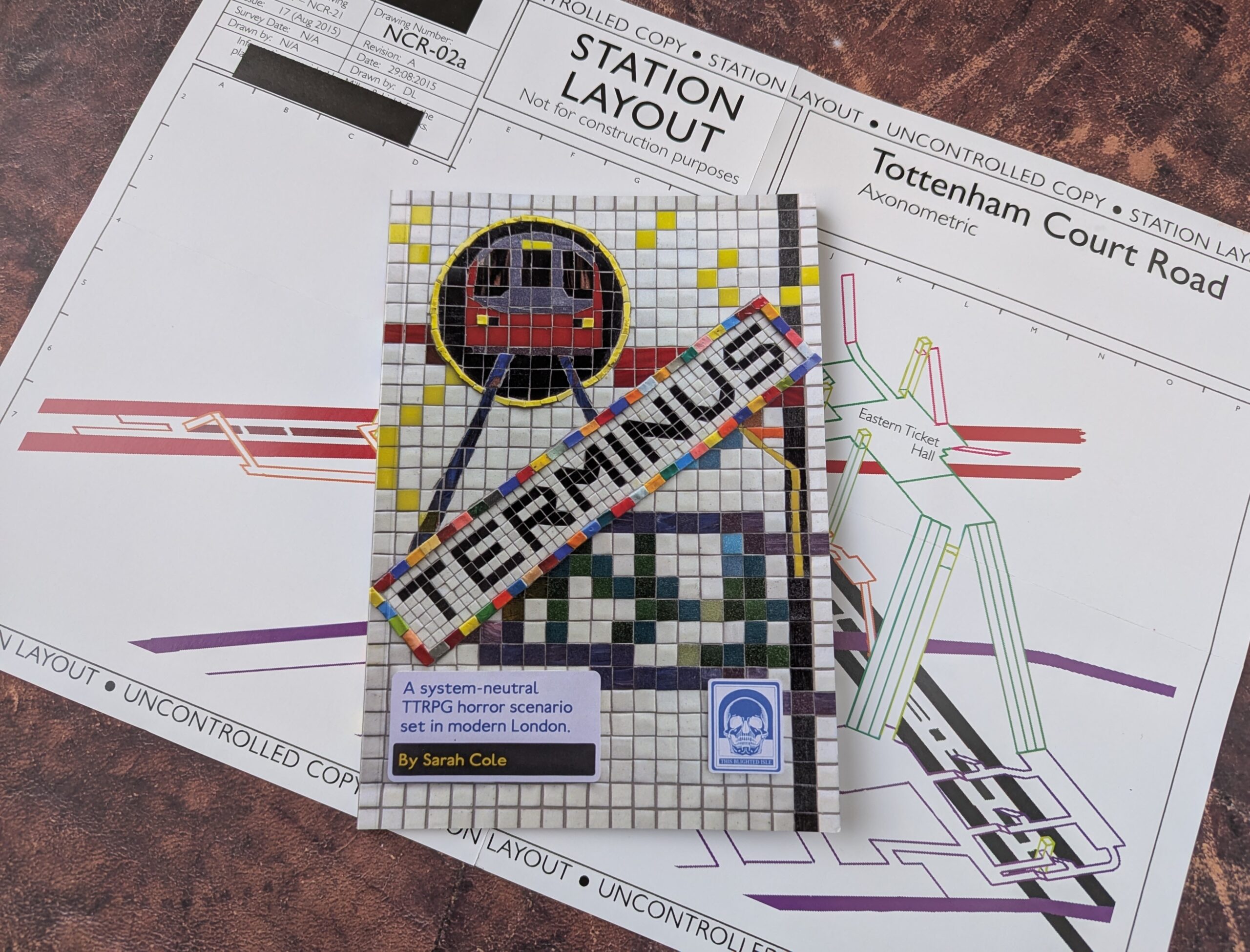 The paperback edition of TERMINUS, accompanied by the included double-sided map handout.